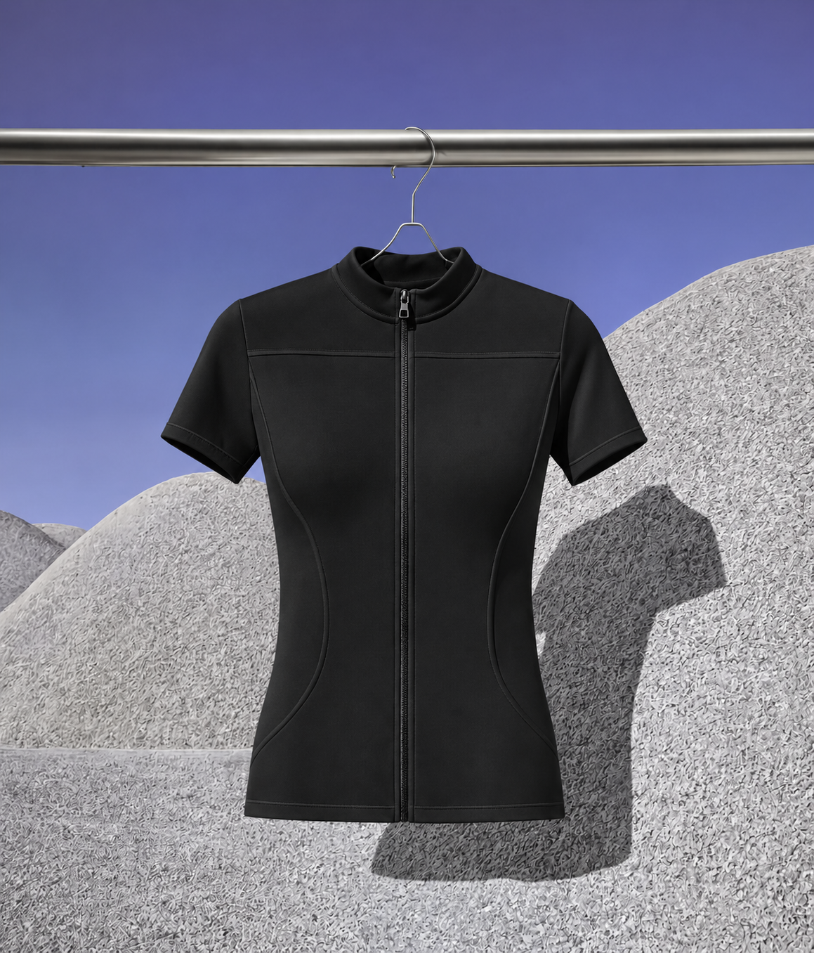 Salt Opera Aero Jacket 001 in black, hanging on a clothing rail against a desert backdrop